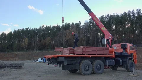 Unloading of building materials by the Material Handling Crane. Stock Footage 234305514