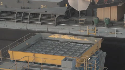 Unloading of cargo ship with a cement by hoe. Stock Footage 89964994