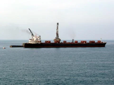 Unloading cargo ship Stock Photos