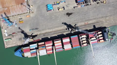 Unloading cargo ship at port Stock Footage 168626651