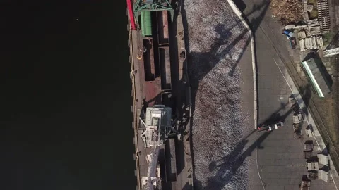 Unloading of cast iron from wagons freight cranes in the industrial area  Stock Footage 196399241