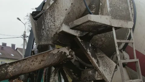 Unloading of cement mixture from concrete mixer truck Video stock 98572029