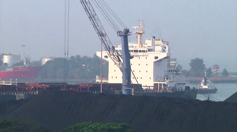 Unloading Coal from Ship in Harbor of Mumbai, India Stock Footage 54717136
