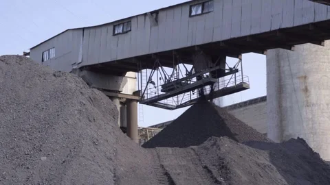 Unloading coal for storage at the power plant warehouse Stock Footage 312832904