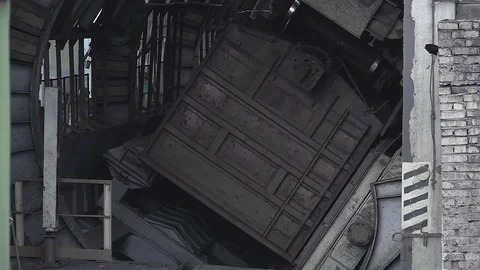 Unloading coal from a wagon. The car rolls up wheels Video stock 83799141