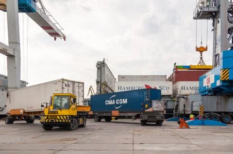 Unloading a container ship in Stetting sea port, Poland Stock Photos