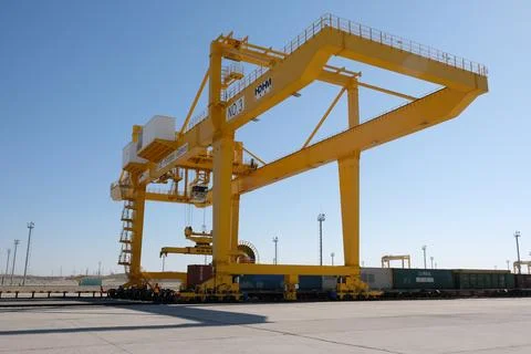 Unloading of containers at the station Stock Photos