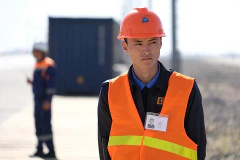Unloading of containers at the station Stock Photos