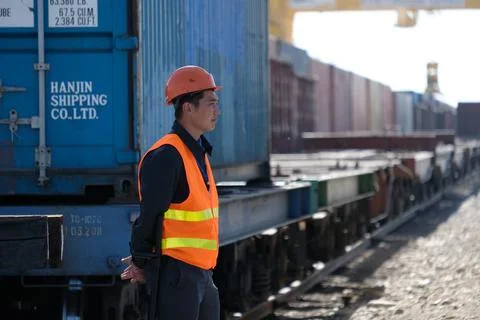 Unloading of containers at the station Stock Photos