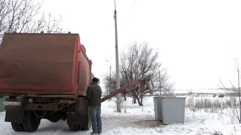 Unloading debris from the container by a specialized machine. Stock Footage 84226877