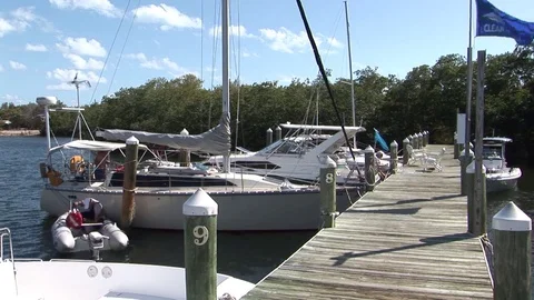 Unloading a dinghy into a sailboat Stock Footage 93225988