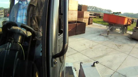 Unloading a forklift from a trailer Stock Footage 4301506