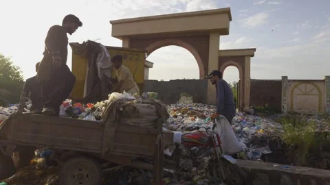 Unloading Garbage Dump From Loader Rikshaw In Islamabad, Pakistan. 18 Aug 2025 Stock Footage 315179318