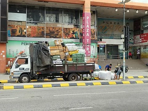 Unloading goods from a lorry Stock Photos