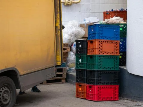 Unloading of goods, plastic containers Stock Photos