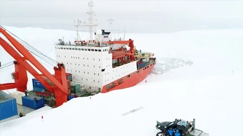 Unloading of large cargoes from a ship in Antarctica Stock Footage 119569731