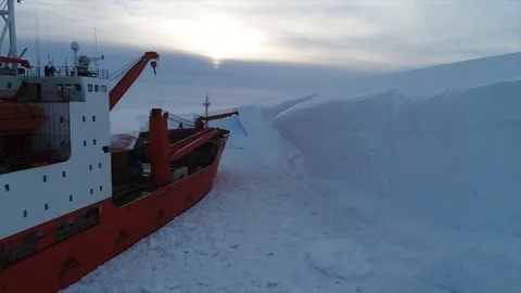 Unloading of large cargoes from a ship in Antarctica Stock Footage 119569864