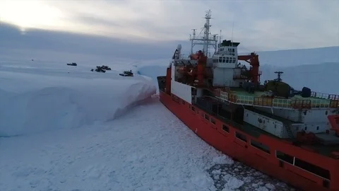 Unloading of large cargoes from a ship in Antarctica Stock Footage 119569883
