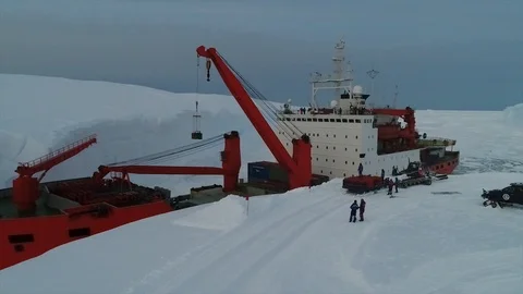 Unloading of large cargoes from a ship in Antarctica Stock Footage 119569978