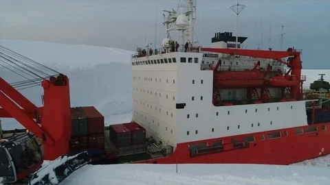 Unloading of large cargoes from a ship in Antarctica Stock Footage 119570494
