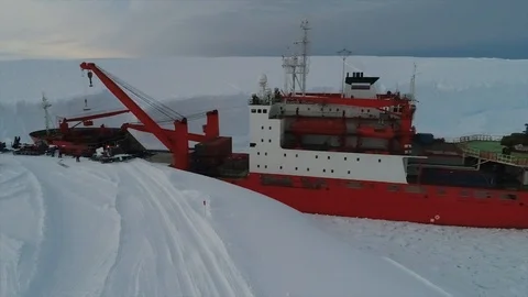 Unloading of large cargoes from a ship in Antarctica Stock Footage 119570688