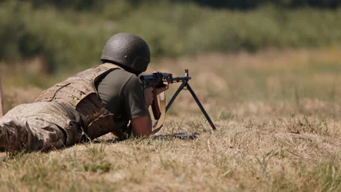Unloading machine gun, soldier lying wit... | Stock Video | Pond5