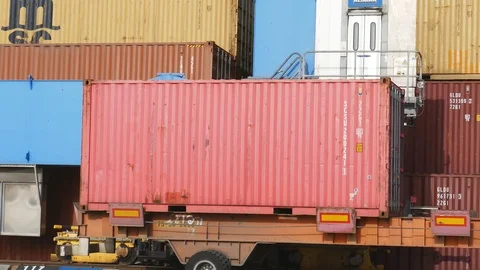 Unloading maneuver in the container terminal 4k Stock Footage 89965384
