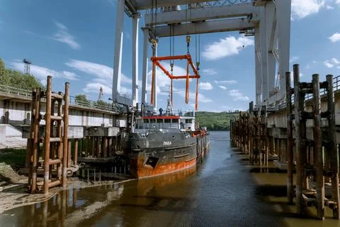 Unloading of the nuclear reactor at the port Stock Photos