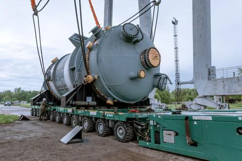 Unloading of the nuclear reactor at the port Stock Photos