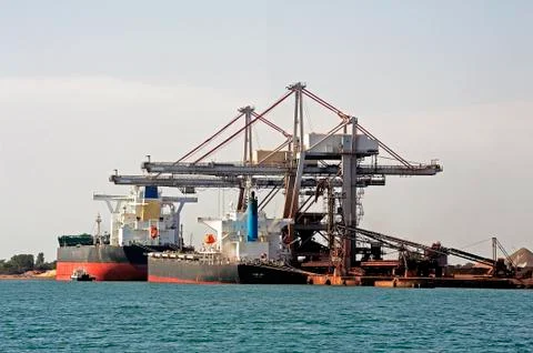 Unloading of an ore cargo liner Stock Photos