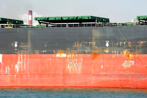 Unloading of an ore cargo liner Stock Photos
