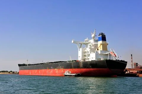Unloading of an ore cargo liner Stock Photos