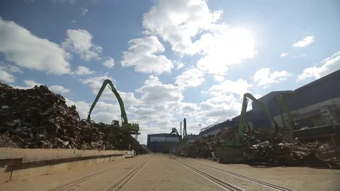 Unloading scrap metal by the huge factory, distant view Stock Footage 72715622
