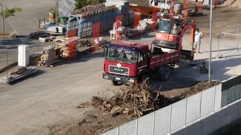 Unloading a small excavator on a construction site Stock-Footage 194568258