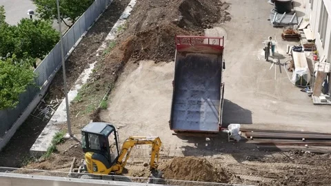 Unloading soil for flower beds on a construction site Stock Footage 193967892
