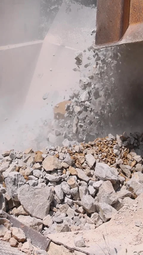 Unloading of stone from the truck to the crusher at open pit mining Stock Footage 341512509