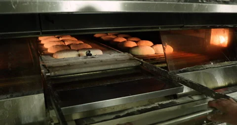Unloading The Tray With Parchment Paper Transferring The Raw Bread Dough Stock Footage 142093663