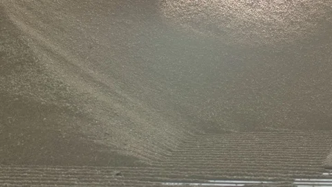 Unloading wheat into mill or silo in slowmotion 4k Stock Footage 125042090