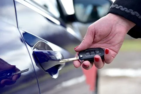 Unlock the car with a pop-up key Stock Photos