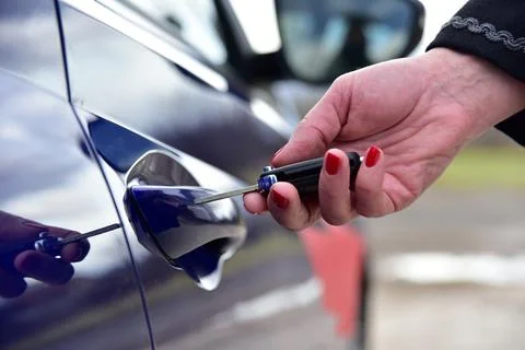 Unlock the car with a pop-up key Stock Photos