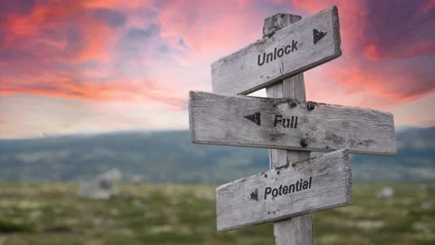 Unlock full potential text engraved in wooden signpost outdoors in nature dur Stock Footage 170629843