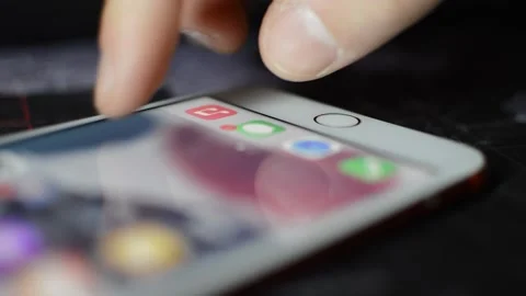 Unlock iphone. man's hand unlock iphone with touch id. Stock Footage 234193846