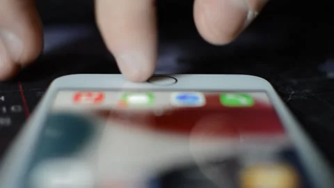 Unlock iphone. man's hand unlock iphone with touch id. Stock Footage 234194049