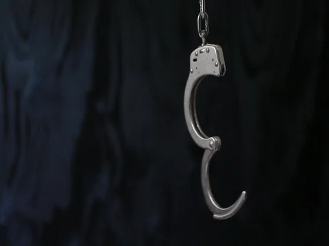 Unlocked handcuffs Stock Footage 80071554