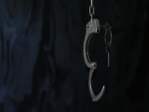 Unlocked handcuffs with key Stock Footage 80071535