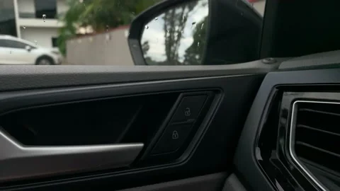 Unlocking and locking a car from inside using door shift button 스톡 동영상 147630018
