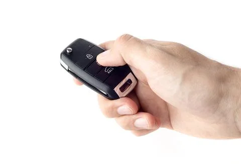 Unlocking a car with button on the keychain. Stock Photos