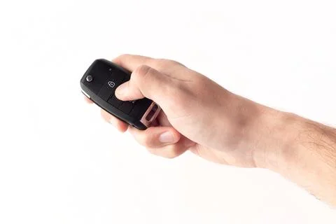 Unlocking a car with button on the keychain. Stock Photos