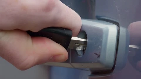 Unlocking a Car Door with a Key A Guide to Accessing Your Vehicle with Precision Stock Footage 308967405