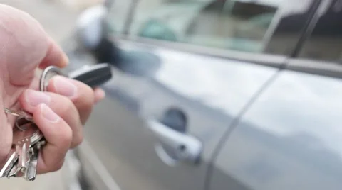 Unlocking car with remote contolled keys 4K 2160p UltraHD footage - Car unlock Stock Footage 54082930